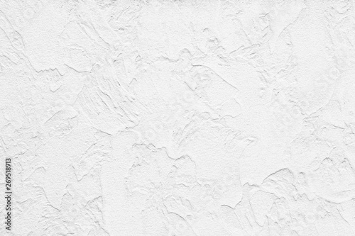 The pattern of painted plaster walls is white texture and background photo