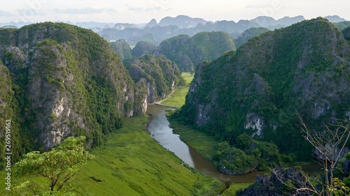 Panoramic view from the top of Mua mountain to a beautiful rock landscape of Ninh Binh and Tam Coc river in Vietnam.