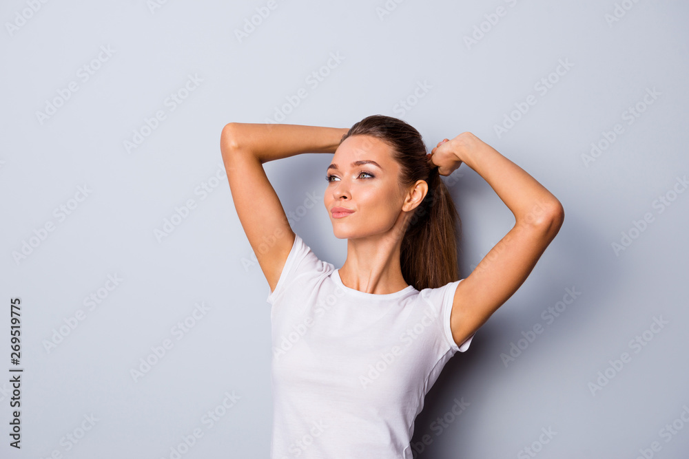 Close up photo beautiful amazing she her lady perfect appearance hands arms raised up above head self-confident person look empty space slim wear casual white t-shirt isolated grey background Close up photo beautiful amazing she her lady perfect appearance hands arms raised up above head self-confident person look empty space slim wear casual white t-shirt isolated grey background