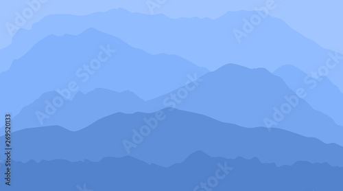 blue calm majestic mountain landscape with fog and mist