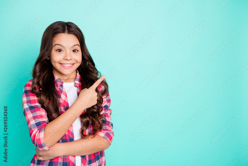 Portrait positive charming cheerful lady little kid advertise ad advise give feedback choose decide news information notice direction fashionable shirt checkered clothing isolated green background