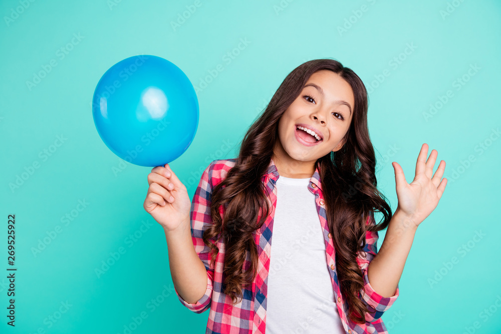 Portrait of her she nice cute attractive cheerful wavy-haired girl in checked shirt holding in hand ball festive celebratory having fun isolated on bright vivid shine green blue turquoise background Portrait of her she nice cute attractive cheerful wavy-haired girl in checked shirt holding in hand ball festive celebratory having fun isolated on bright vivid shine green blue turquoise background