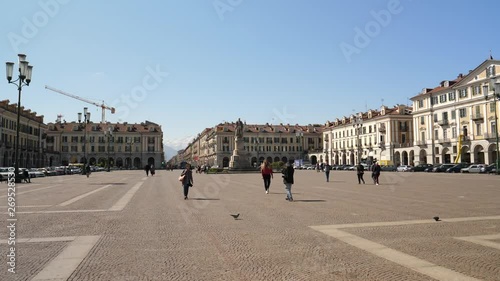 Persone camminano in Piazza Galimberti a Cuneo photo