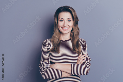 Portrait of her she nice-looking attractive charming cheerful cheery glad wavy-haired lady folded arms isolated over gray pastel violet purple background