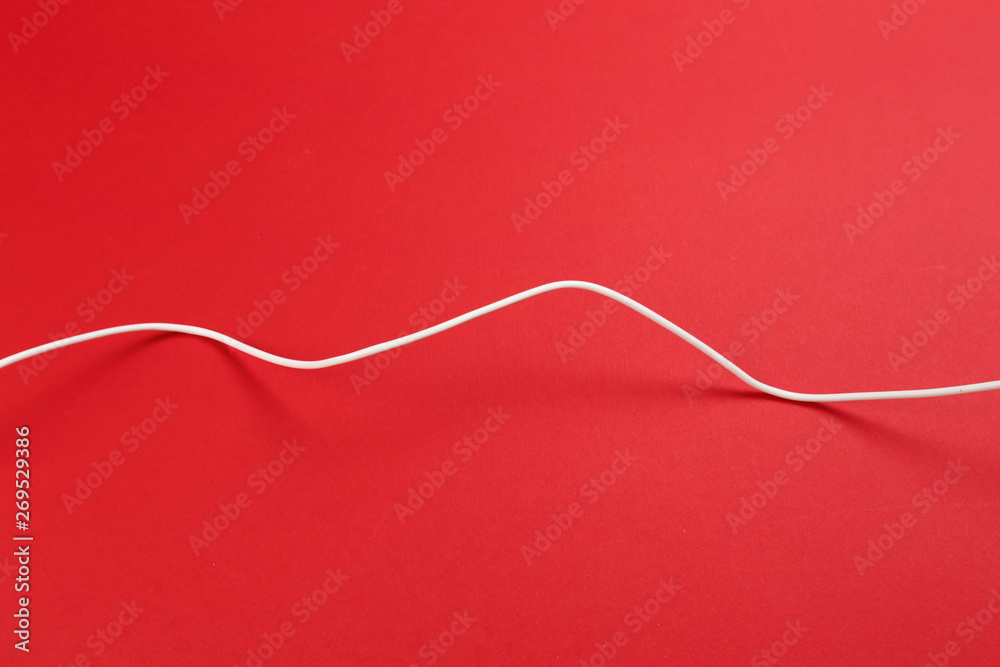 white power cable socket on red background white power cable socket on red background
