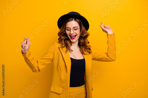 Portrait of her she nice-looking charming cute attractive lovely adorable fascinating chic cheerful cheery wavy-haired lady having fun isolated on bright vivid shine orange background © deagreez