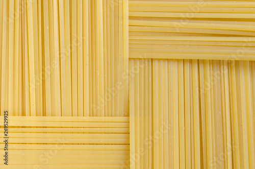 Rectangular geometric pattern of pasta bavette. bavette. Background image of pasta from durum wheat.