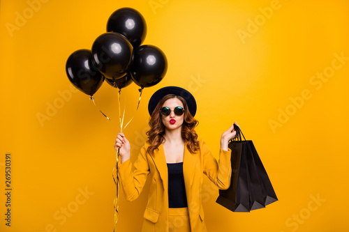 Close up photo beautiful she her lady vacation abroad send air kiss carry packs perfect look buy buyer present gift balloons sale discount wear specs formal-wear suit isolated yellow bright background