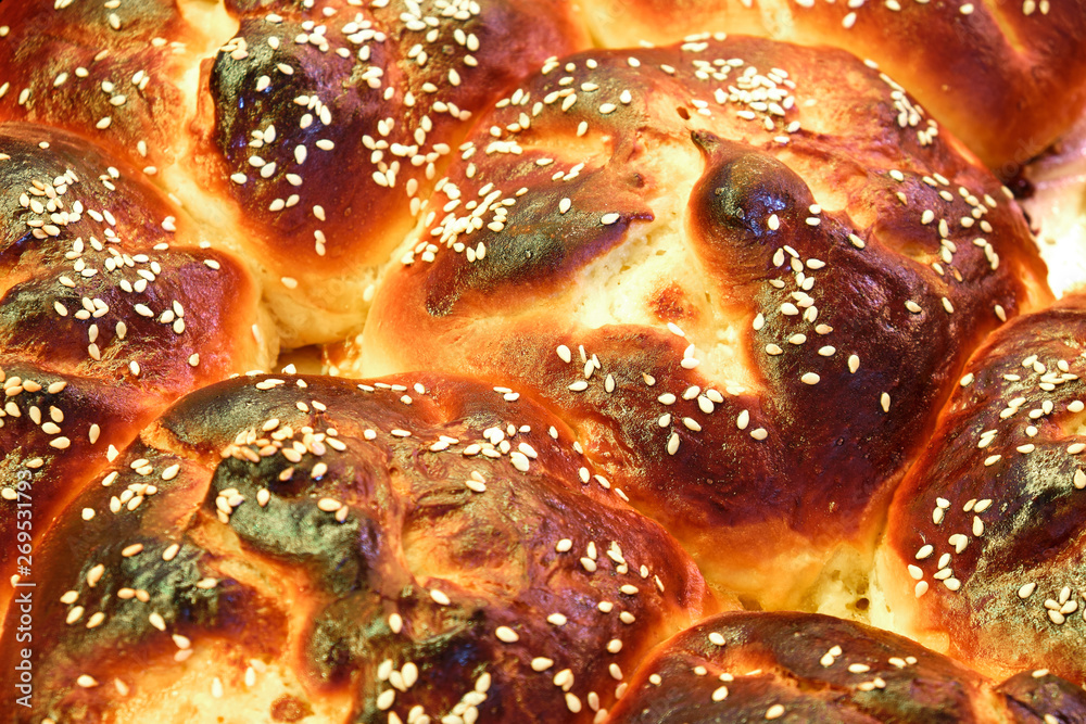 Details of traditional homemade pie called Poale-n brau in Bucovina / Moldova region, Romania, with extra sesame seeds on top. Vegetarian dessert concept. Details of traditional homemade pie called Poale-n brau in Bucovina / Moldova region, Romania, with extra sesame seeds on top. Vegetarian dessert concept.