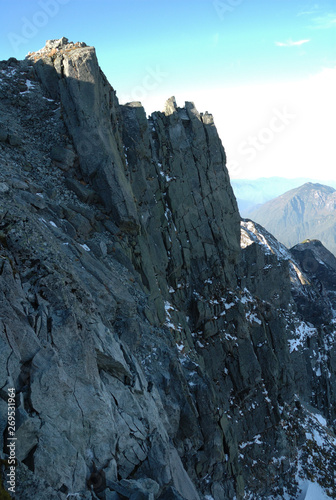 Takidani cliff @Mt. Kita-hotakadake summit / 北穂高岳山頂の滝谷北壁(初冠雪, 正午) photo