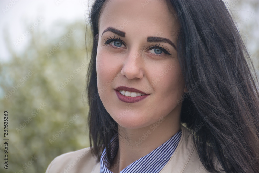 Magnificent passionate young brunette woman with perfect skin and white teeth. Presenting your product. Expressive facial expressions. Copy space. Magnificent passionate young brunette woman with perfect skin and white teeth. Presenting your product. Expressive facial expressions. Copy space.