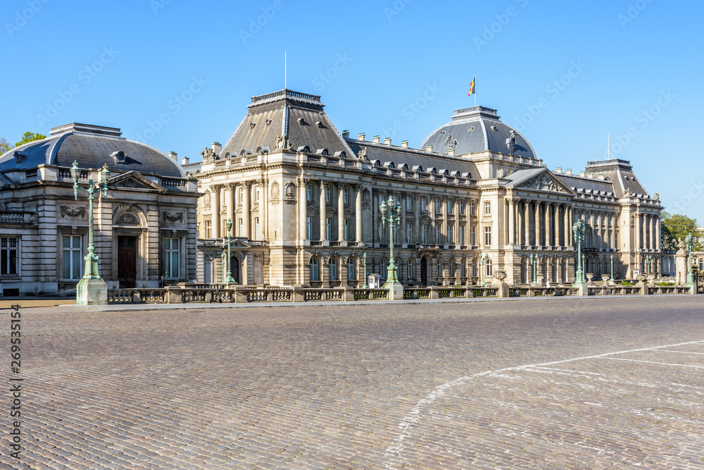 Three-quarter view of the main facade of the Royal Palace of Brussels, the official palace of the King and Queen of the Belgians in the historic center of Brussels, Belgium, on a sunny morning.