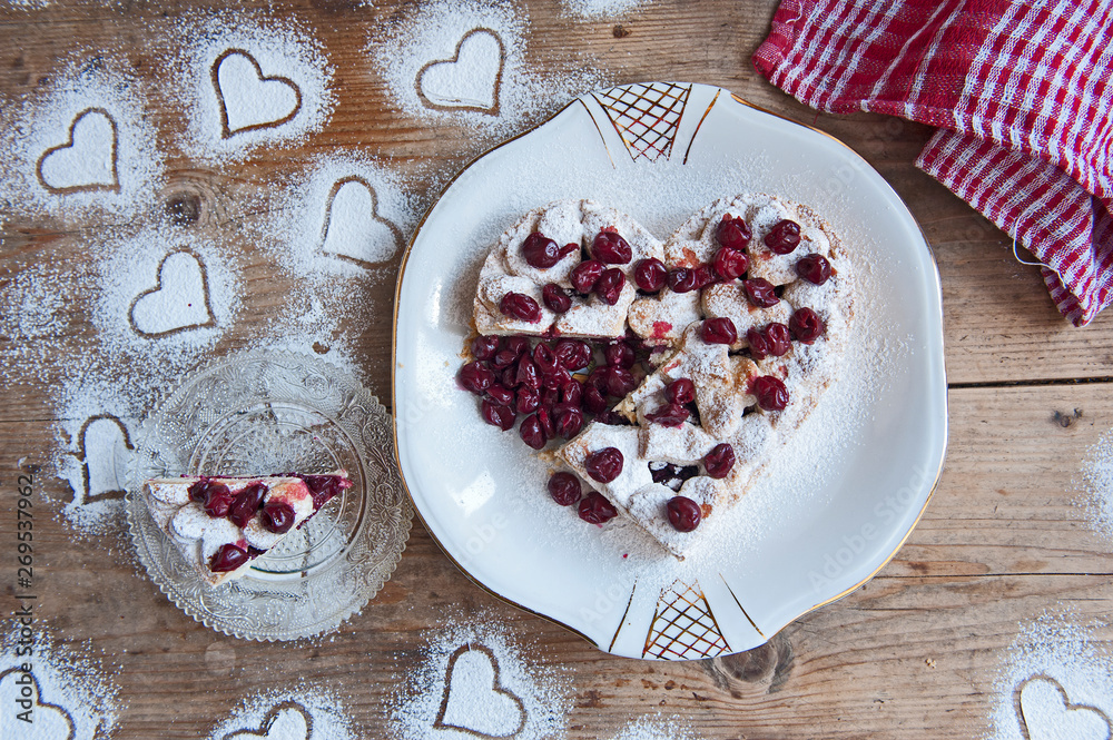 Cherry pie with heart shaped on the rustic background