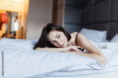 Young beautiful girl wake up in the morning at home