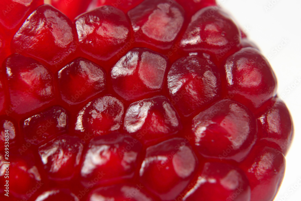peeled pomegranate fruit closeup on white background peeled pomegranate fruit closeup on white background
