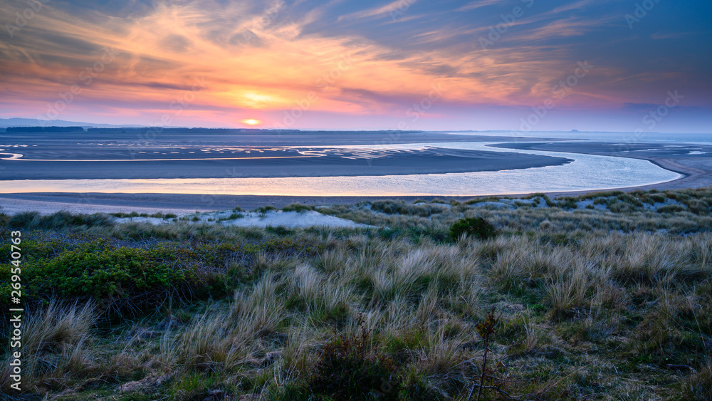 Sunset at Budle Bay, the mud flats at low tide are part of Lindisfarne Nature reserve on Northumberland's AONB coastline