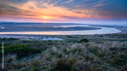 Sunset at Budle Bay, the mud flats at low tide are part of Lindisfarne Nature reserve on Northumberland's AONB coastline