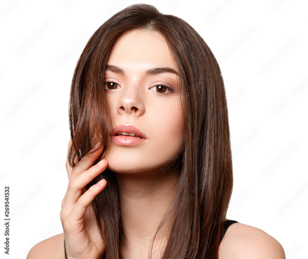 Fototapeta premium beauty portrait of a young beautiful brunette girl with brown eyes and straight long flowing hair isolated on white background