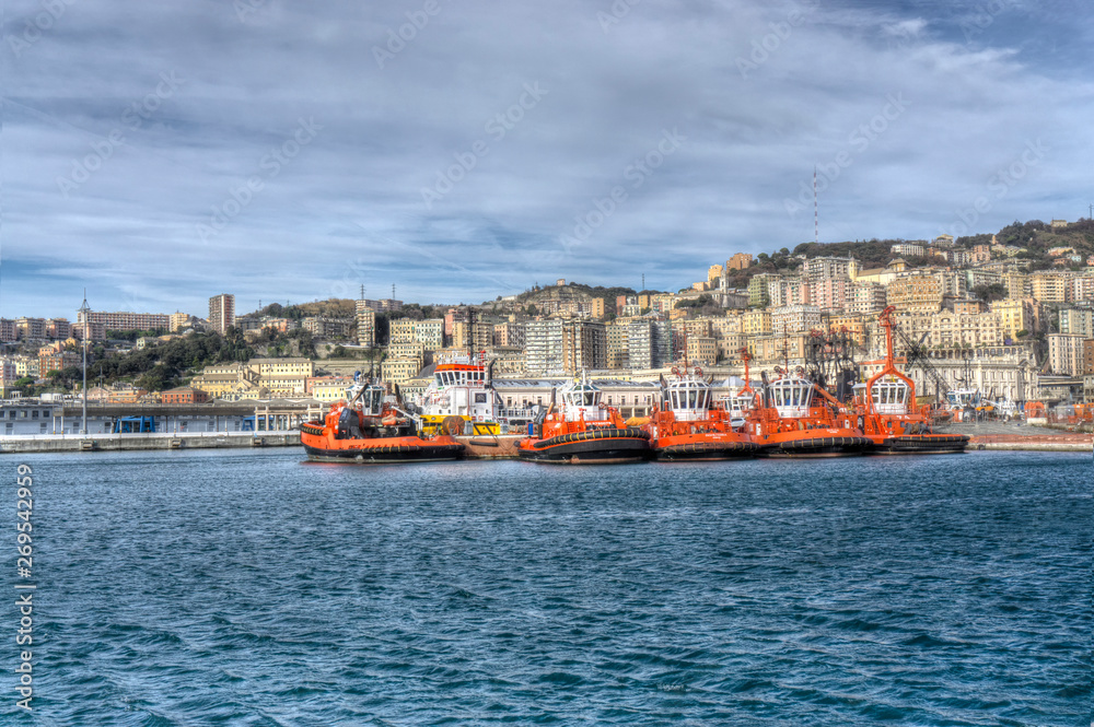orange towboats in port