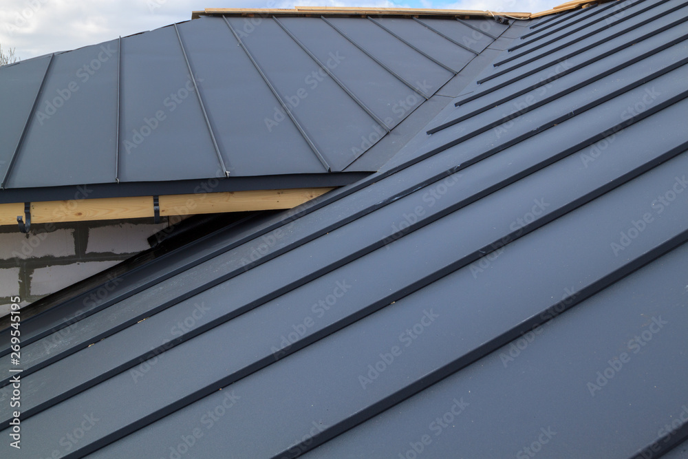 Obraz premium close up view of house under construction with grey folding roof on waterproofing layer