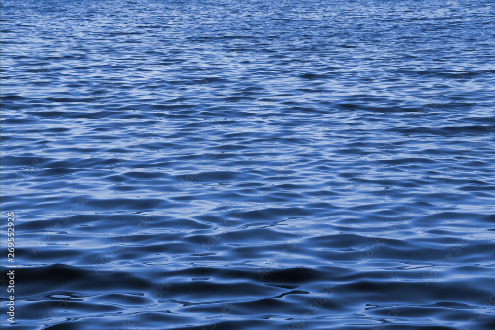 Wavy blue water surface as a landscape background Wavy blue water surface as a landscape background