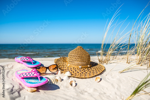 Fototapeta Naklejka Na Ścianę i Meble -  Blue sky, sea and vacation beach with accessories, summer holiday background, Baltic Sea, Poland