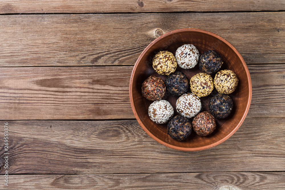 Energy balls made from a natural mixture of dried fruits and nuts(dates,dried apricots,raisins,walnuts,prunes). Healthy diet. Energy balls made from a natural mixture of dried fruits and nuts(dates,dried apricots,raisins,walnuts,prunes). Healthy diet.