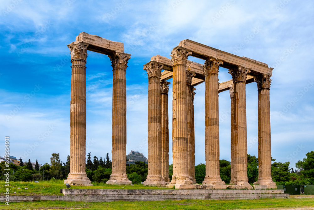 Athens, Attica / Greece. The Temple of Olympian Zeus, also known as the Olympieion or Columns of the Olympian Zeus, is a former colossal temple at the center of Athens. Sunny day, cloudy sky, nobody