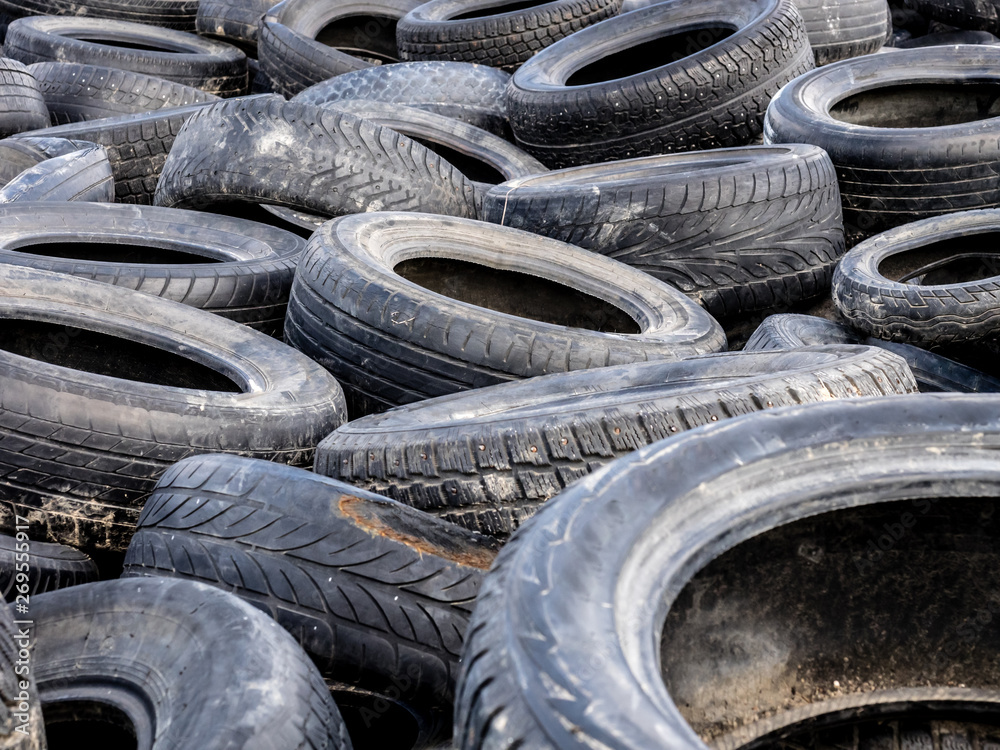 Large pile of tires dump. Illegal garbage dump. The concept of ecology pollution. Large pile of tires dump. Illegal garbage dump. The concept of ecology pollution.