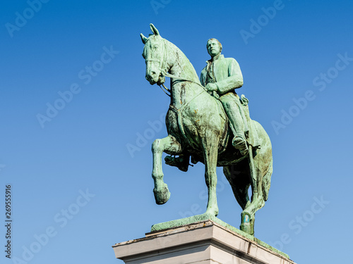 Low angle view of the equestrian statue of King Albert I of Belgium on the Mont des Arts in Brussels, Belgium, against blue sky.