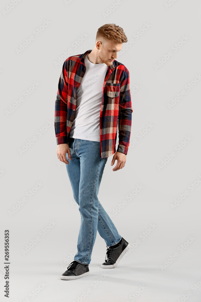 Fashionable young man on light background Fashionable young man on light background