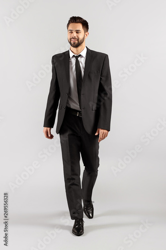Fashionable young man on gr...