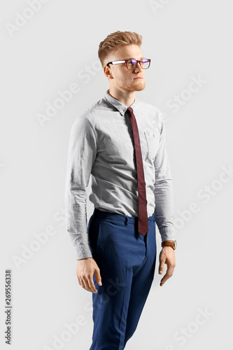 Fashionable young man on gr...