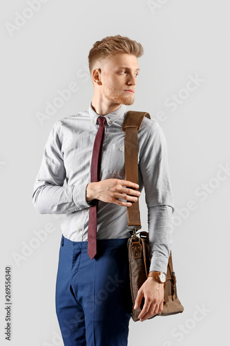 Fashionable young man on gr...
