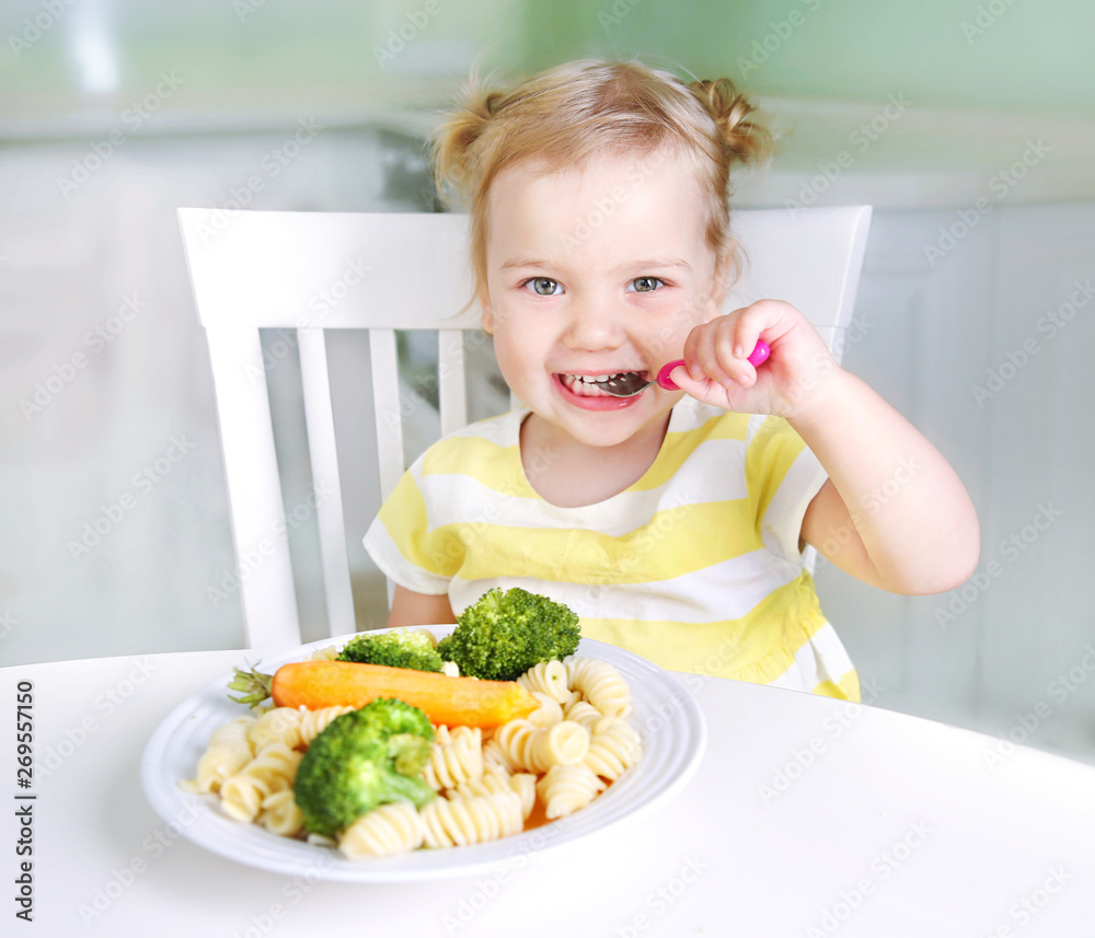 Child girl eating vegetables,healthy kid's nutrition. Child girl eating vegetables,healthy kid's nutrition.