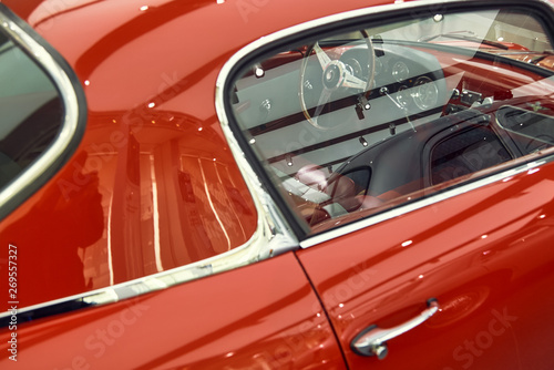 Classic red Italian car - vehicle interior of vintage car.