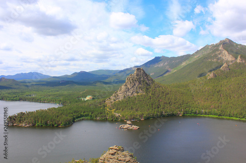 Panorama of the stone-rock Zhumbaktas in the lake and mountains photo