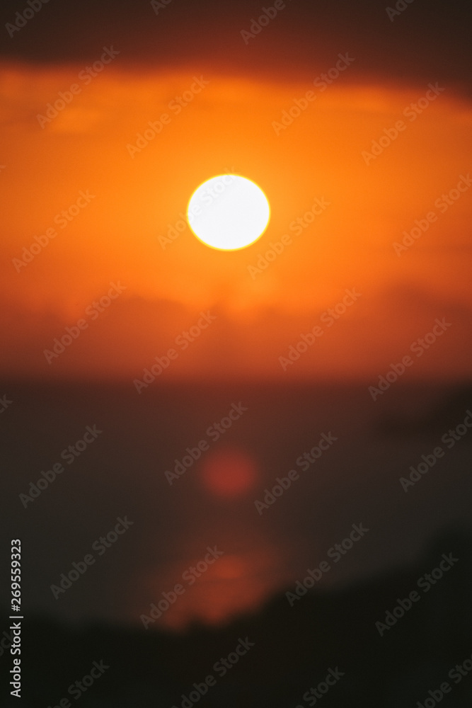 Sunset orange out of focus close-up sun in the middle. Sunset orange out of focus close-up sun in the middle.