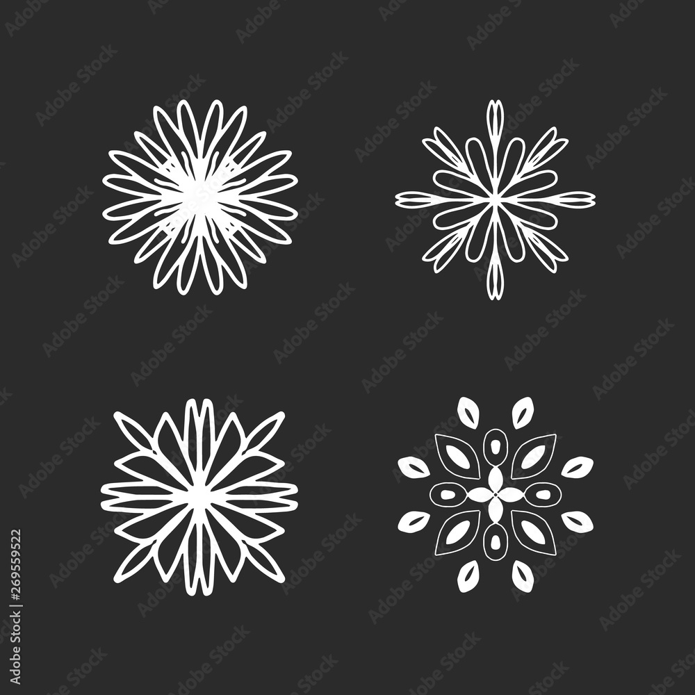 White hand-drawn flowers on black chalkboard White hand-drawn flowers on black chalkboard