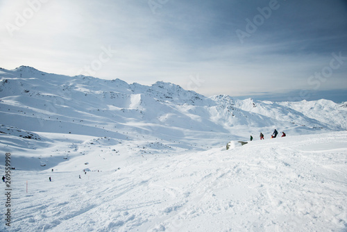 Skiers off piste in alpine ski resort