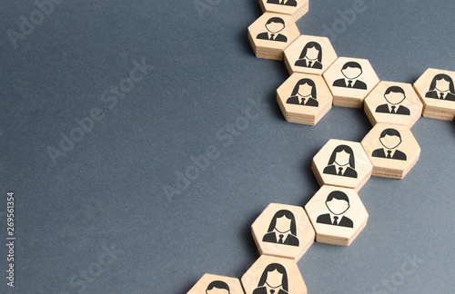 Symbols of employees on the chains of hexagons. The concept of business connections. Team building, business organization and staff hierarchy. Human resources management, recruitment. Single whole. photo