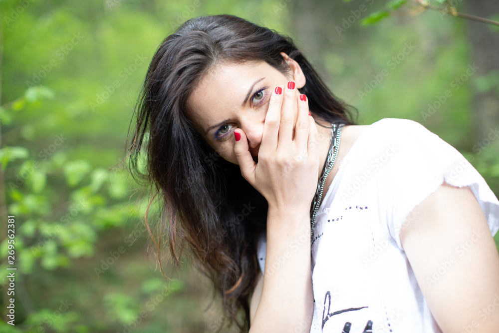 Young woman in the forest modelling