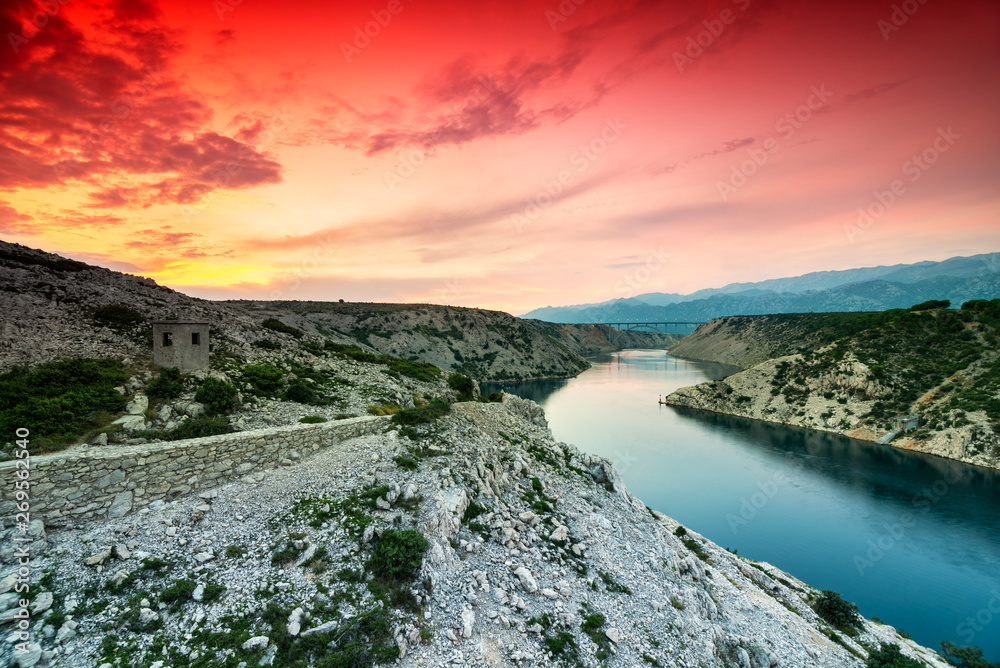 Naklejka premium Colorful Dramatic Sunset Over the River And Mountains In Dalmatia, Croatia