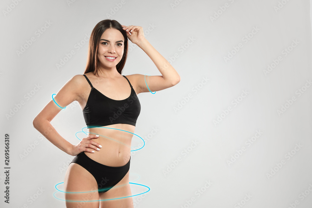 Attractive young woman with sexy slim body in underwear on light background. Space for text Attractive young woman with sexy slim body in underwear on light background. Space for text