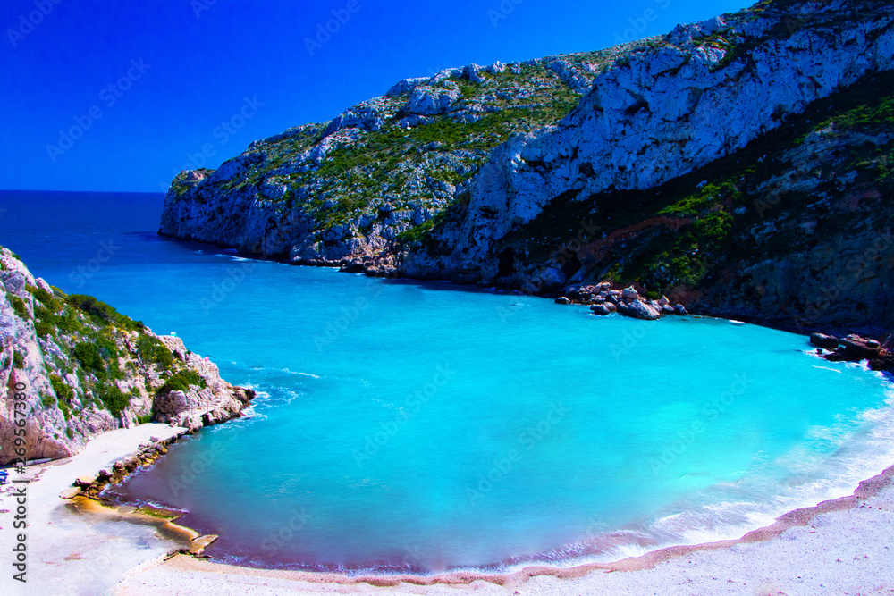 Obraz premium Beach of Granadella one beach in Spain very famous beach in The Mediterranean sea with turquoise waters