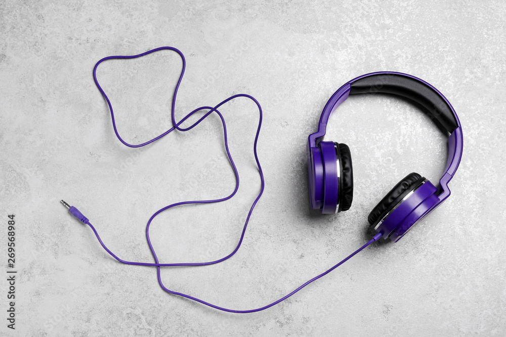 Stylish headphones on grey background, top view Stylish headphones on grey background, top view
