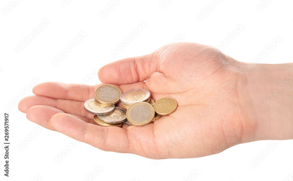 Man holding coins in hand on white background, closeup Man holding coins in hand on white background, closeup