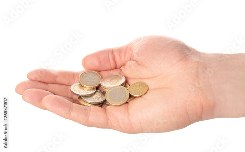 Man holding coins in hand on white background, closeup