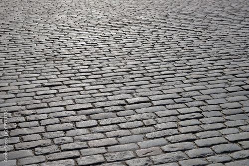 Old cobblestone pavement close up.