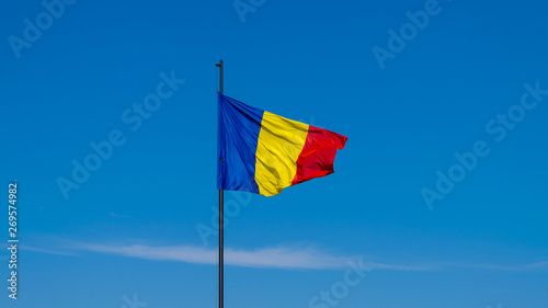 Romanian flag waving on a sunny summer day in Alba Iulia, Romania